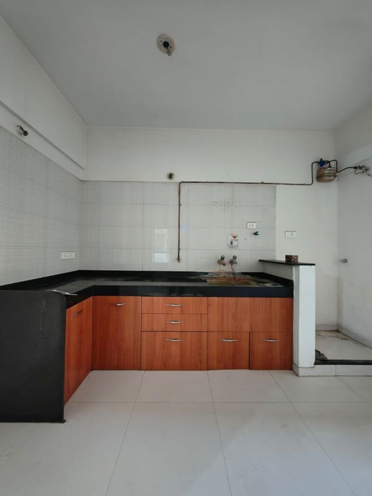 Kitchen, nyati-elan 2 Bedroom 821 Sq.Ft. Apartment In Wagholi Pune 10570090