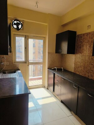Kitchen in 2 BHK Apartment at Aims Golf City, Sector 75 – for Rent