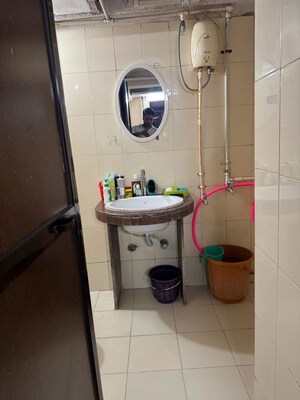 Bathroom in 1 BHK Apartment at Royal Palms Garden View, Goregaon East – for Rent