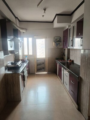 Kitchen in 3.5 BHK Apartment at Gardenia Golf City, Sector 75 – for Rent