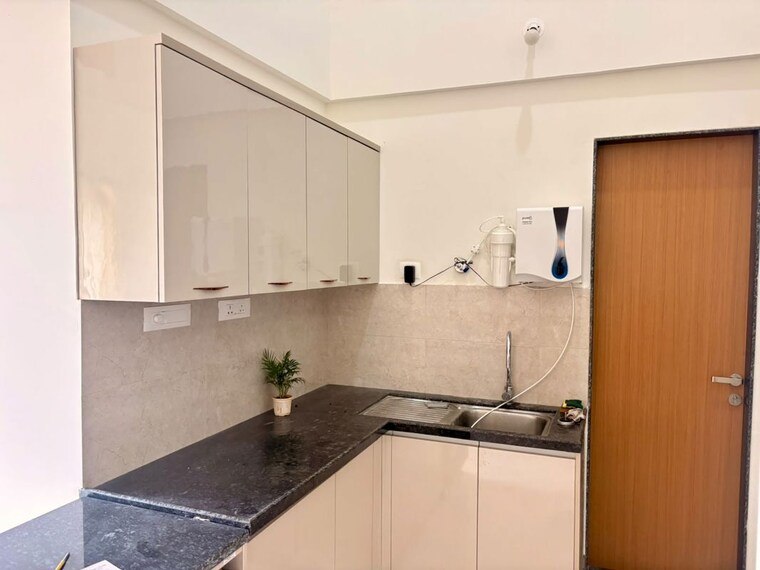 Kitchen, gera-planet-of-joy 2 Bedroom 850 Sq.Ft. Apartment In Kharadi Pune 10571622