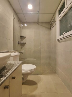Bathroom in 3 BHK Apartment at Bhartiya Nikoo Homes Phase 2, Thanisandra Main Road – for Rent
