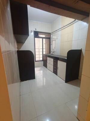 Kitchen in 3 BHK Apartment at Nilkanth Dhara CHS Kamothe, Kamothe Sector 21 – for Rent