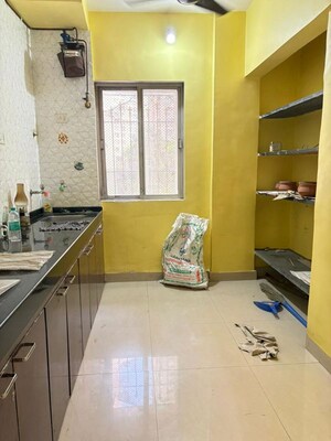 Kitchen in 2 BHK Apartment at Shubharambh Complex, Manpada – for Rent