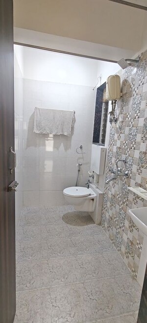 Bathroom in 1 BHK Apartment at Dharti Pressidio, Kandivali West – for Rent
