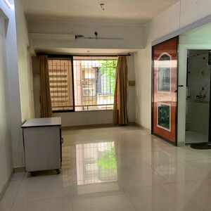 Living Room in 1 BHK Apartment at Om Sai Shravan CHS, Shimpoli – for Rent