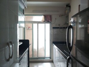 Kitchen in 2 BHK Apartment at Mahavir Kalpavruksha, Ghodbunder Road – for Rent
