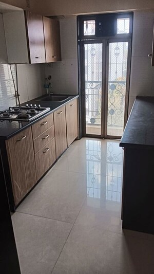 Kitchen in 2 BHK Apartment at Woodland Crest Apartment, Andheri East – for Sale