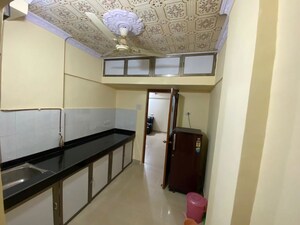 Kitchen in 2 BHK Apartment at Vaibhav Vilas CHS, Majiwada – for Sale