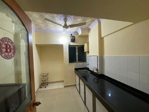 Kitchen in 2 BHK Apartment at Vaibhav Vilas CHS, Majiwada – for Sale