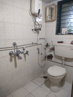 Bathroom in 2 BHK Apartment at Vaibhav Vilas CHS, Majiwada – for Sale