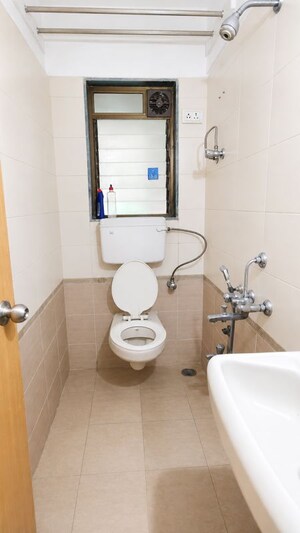 Bathroom in 1 BHK Apartment at Prime CHS, Mulund East – for Rent