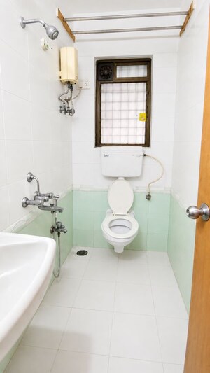 Bathroom in 1 BHK Apartment at Prime CHS, Mulund East – for Rent