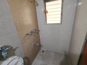 Bathroom in 2 BHK Apartment at Puranik City, Kasarvadavali – for Rent