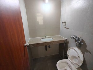 Bathroom in 2 BHK Apartment at Puranik City, Kasarvadavali – for Rent