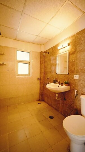 Bathroom in 2.5 BHK Apartment at Kingswood Court, Sain Vihar – for Sale