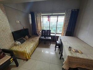 Living Room in 2 BHK Apartment at Vijay Enclave, Waghbil – for Rent
