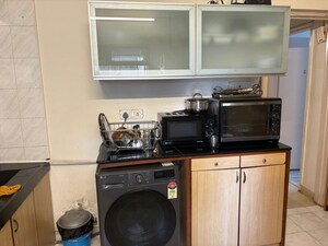 Kitchen in 2 BHK Apartment at Indradarshan II, Oshiwara – for Sale