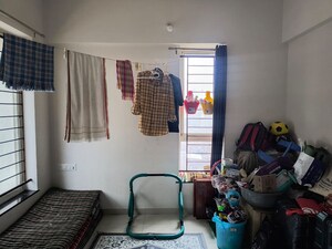 Living Room in 2 BHK Apartment at Kolte Patil Little Earth, Kiwale – for Rent