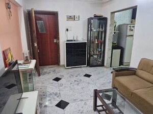 Living Room in 1 BHK Apartment at Unique Tower, Sion – for Rent