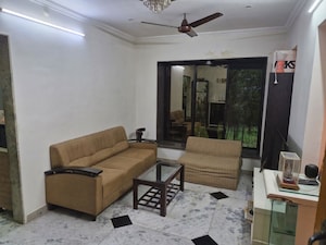 Living Room in 1 BHK Apartment at Unique Tower, Sion – for Rent