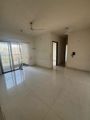 Living Room in 2 BHK Apartment at Lodha Amara, Kolshet Road – for Sale