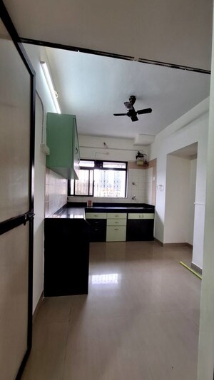Kitchen in 2 BHK Apartment at Cosmos Heritage, Manpada – for Rent