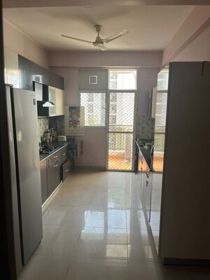 Kitchen in 2.5 BHK Apartment at Prateek Wisteria, Sector 77 – for Sale