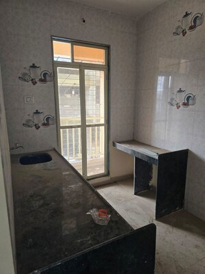 Kitchen in 2 BHK Apartment at Kavya Shrushti Estate, Kalher – for Sale