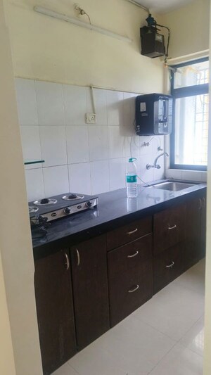 Kitchen in 1 BHK Apartment at Ram Pushpanjali Residency, Owale – for Rent
