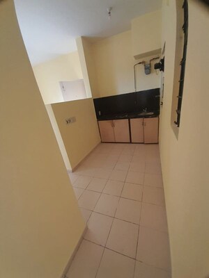 Kitchen in 1 BHK Apartment at Bengal Ambuja Upohar, Em Bypass – for Sale