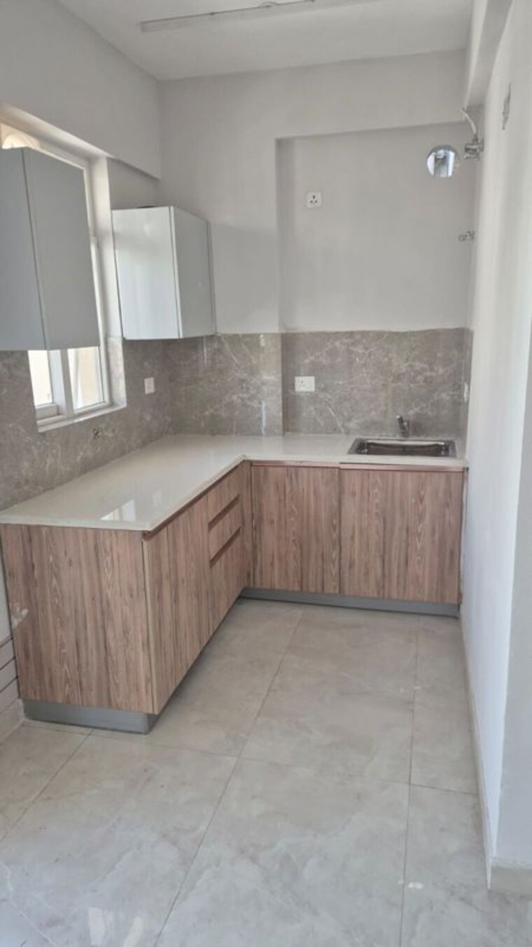 Kitchen, signature-global-the-millennia 2 Bedroom 950 Sq.Ft. Apartment In Sector 37d Gurgaon 10576360