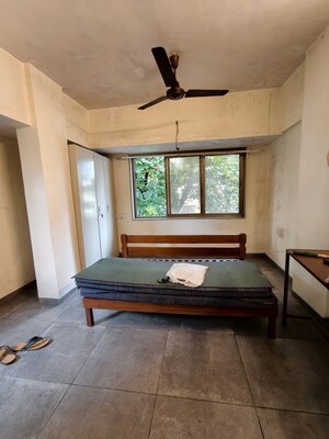 Bedroom in 1 BHK Apartment at Golders Green CHS, Borivali West – for Rent