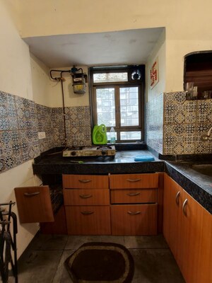 Kitchen in 1 BHK Apartment at Golders Green CHS, Borivali West – for Rent