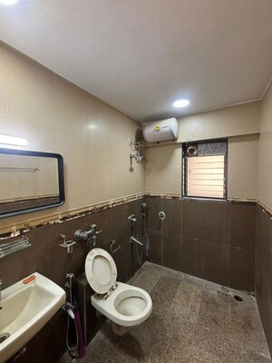 Bathroom in 3 BHK Apartment at Transcon Flora Heights, Andheri West – for Rent