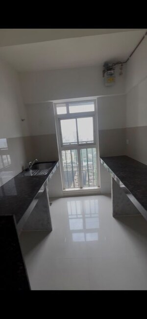Kitchen in 4 BHK Apartment at Raymond The Address, Pokhran Road No Two – for Sale