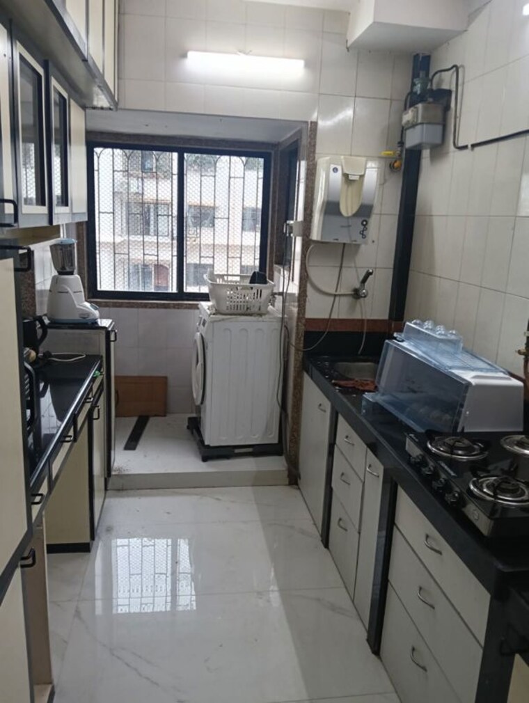 Kitchen, lokhandwala complex 3 Bedroom 1300 Sq.Ft. Apartment In Lokhandwala Complex Mumbai 10577349