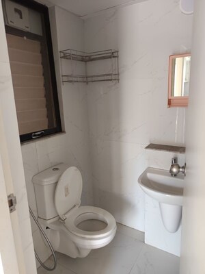 Bathroom in 1 BHK Apartment at Runwal Gardens, Dombivli East – for Rent