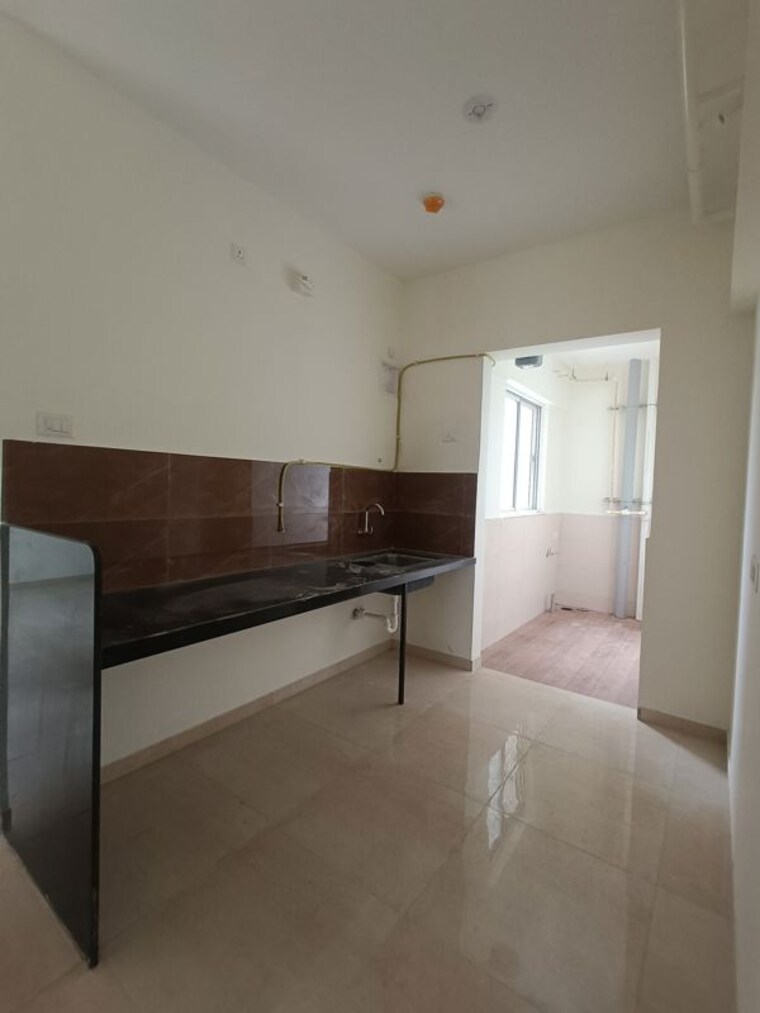 Kitchen, kolte-patil-life-republic-arezo 2 Bedroom 850 Sq.Ft. Apartment In Hinjewadi Pune 10577773