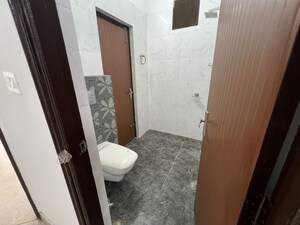 Bathroom in 2 BHK Apartment at Dhakoli – for Sale