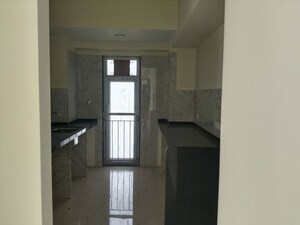 Kitchen in 3 BHK Apartment at Ruparel Ariana, Parel – for Sale