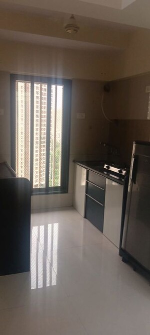 Kitchen in 2 BHK Apartment at Metropolis Rivera, Kasarvadavali – for Rent