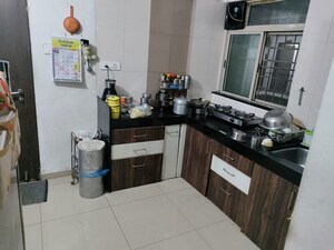 Kitchen in 2 BHK Apartment at Mahalaxmi Nagar CHS, Warje – for Rent