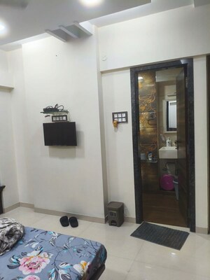 Living Room in 2 BHK Apartment at Vikas Park CHS, Malad West – for Rent