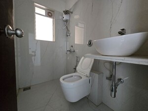 Bathroom in 3 BHK Apartment at Anmol Priti, Kandivali West – for Sale