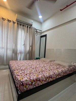 Bedroom in 2 BHK Apartment at Transcon Triumph Tower, Andheri West – for Rent