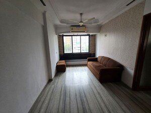Living Room in 2 BHK Apartment at Pawanputra CHS, Kandivali West – for Rent
