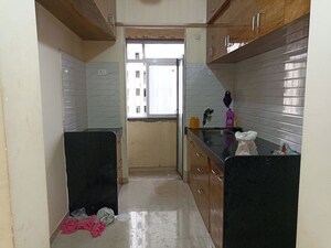 Kitchen in 2 BHK Apartment at Ram Pushpanjali Residency, Owale – for Rent