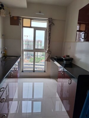 Kitchen in 1 BHK Apartment at Metropolis Bayside, Kasarvadavali – for Rent