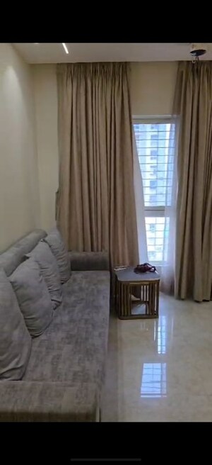 Living Room in 2 BHK Apartment at Lodha Amara, Kolshet Road – for Rent